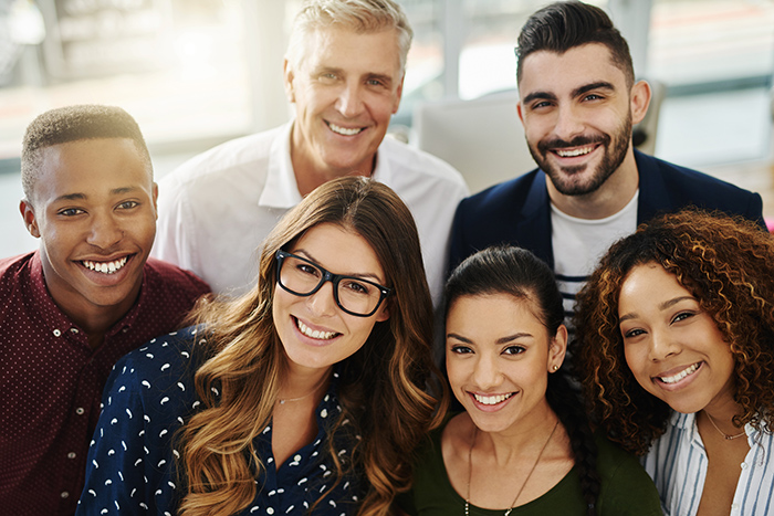 Smiling group of professional men an women