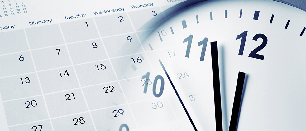 Close up of clock and calendar