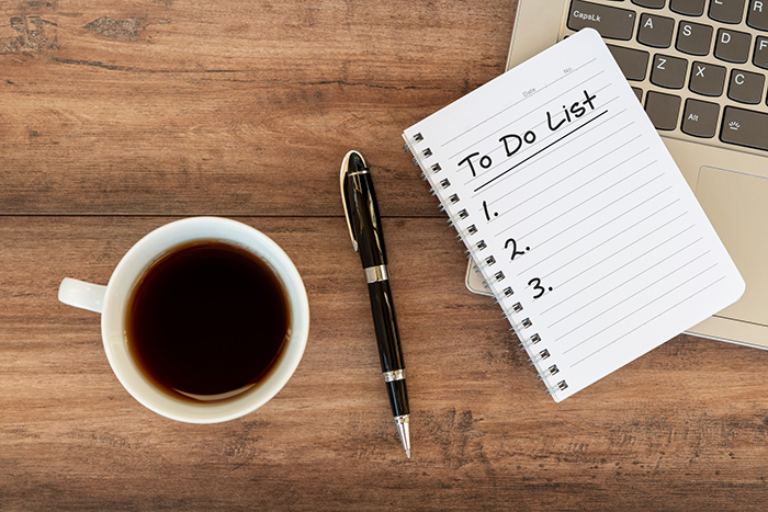 To do list on top of laptop keyboard