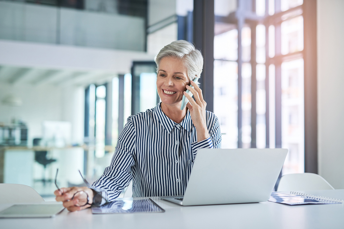 Mature business woman talking on mobile phone