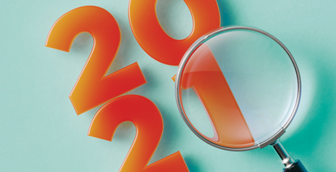 2021 with a magnifying glass hovering over it