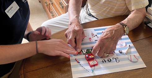 Collaborating to put the finishing touches on a memory box